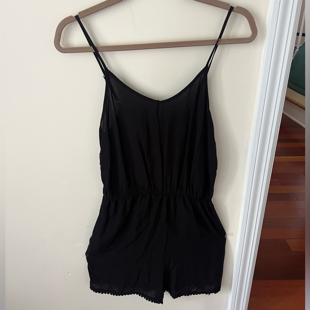 Women’s Mossimo Black Spaghetti Strap Romper with Bottom Hem Detail | Target